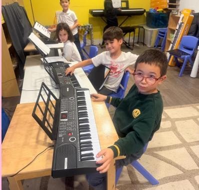 Children enjoying music and instrument classes at Kidspot Surrey